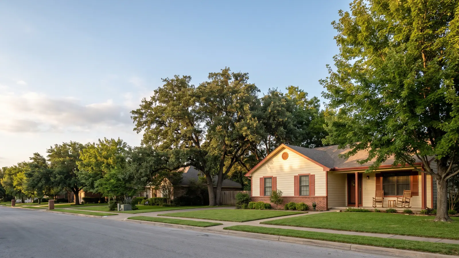 A quiet residential street lined with homes in a Mount Laurel 55+ community